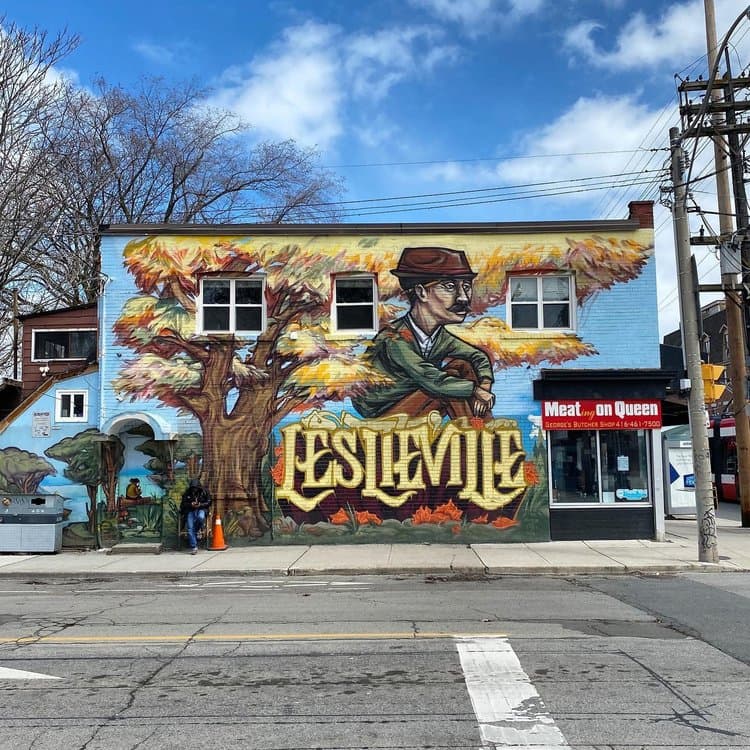 Leslieville mural on Queen Street East, Toronto — large "LESLIEVILLE" lettering and neighbourhood landmark art